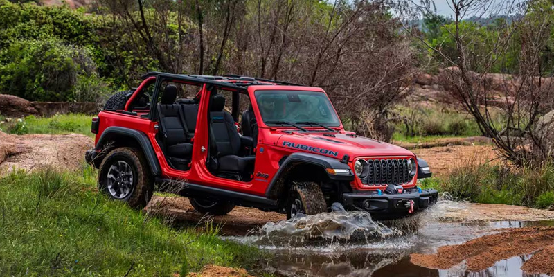 2025 Jeep Wrangler crossing a river